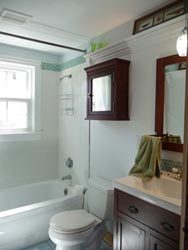 Full shower and tub with a high showerhead.